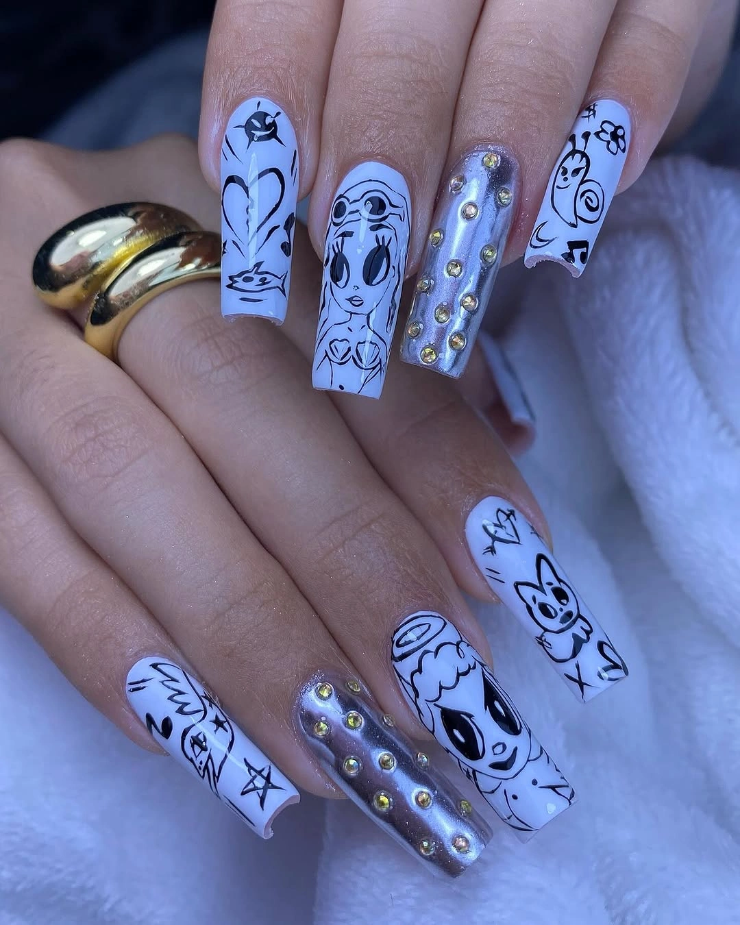 Long lavender square nails with black line art and studs