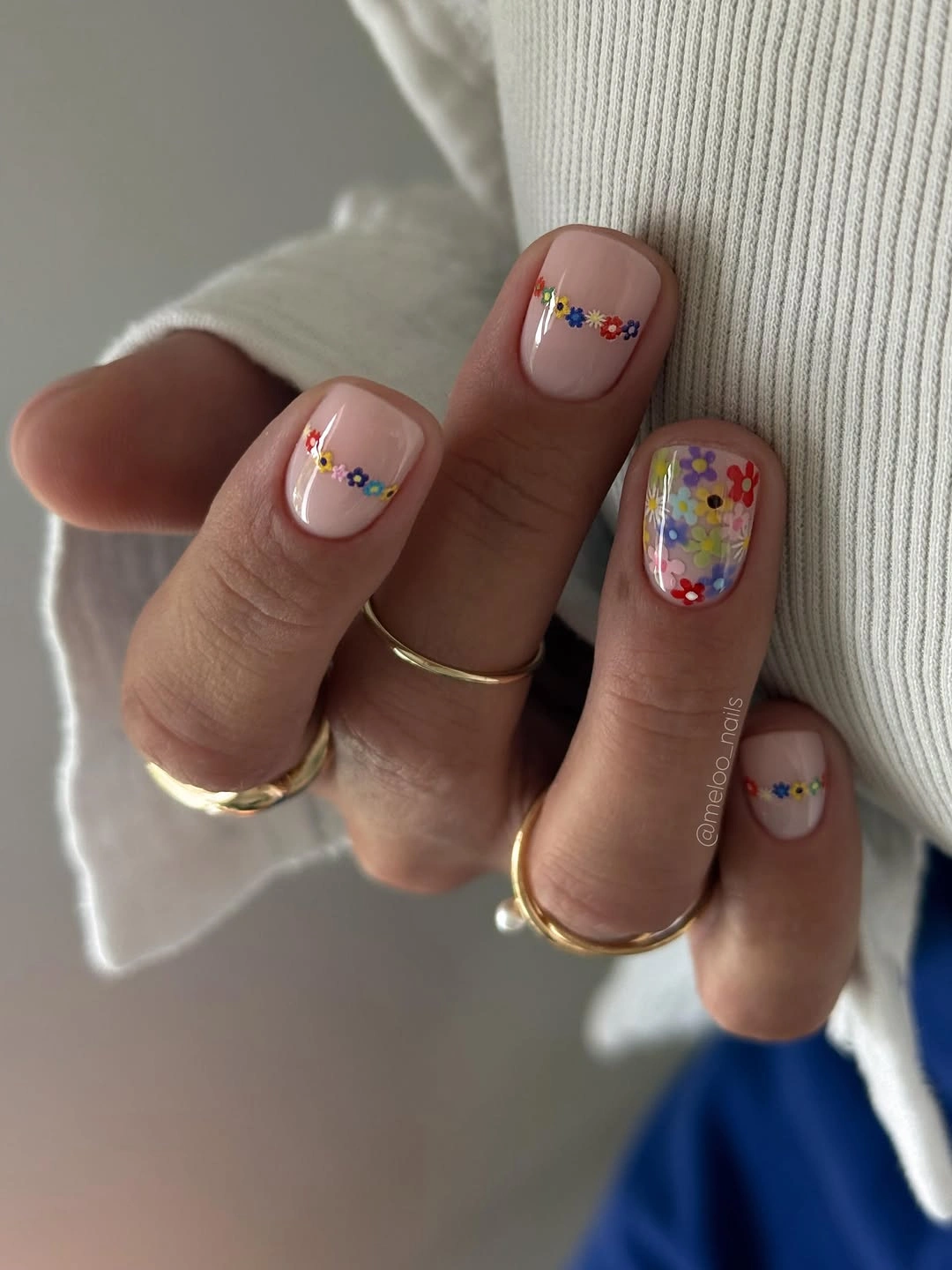 Nude short nails with tiny multicolor flower accents
