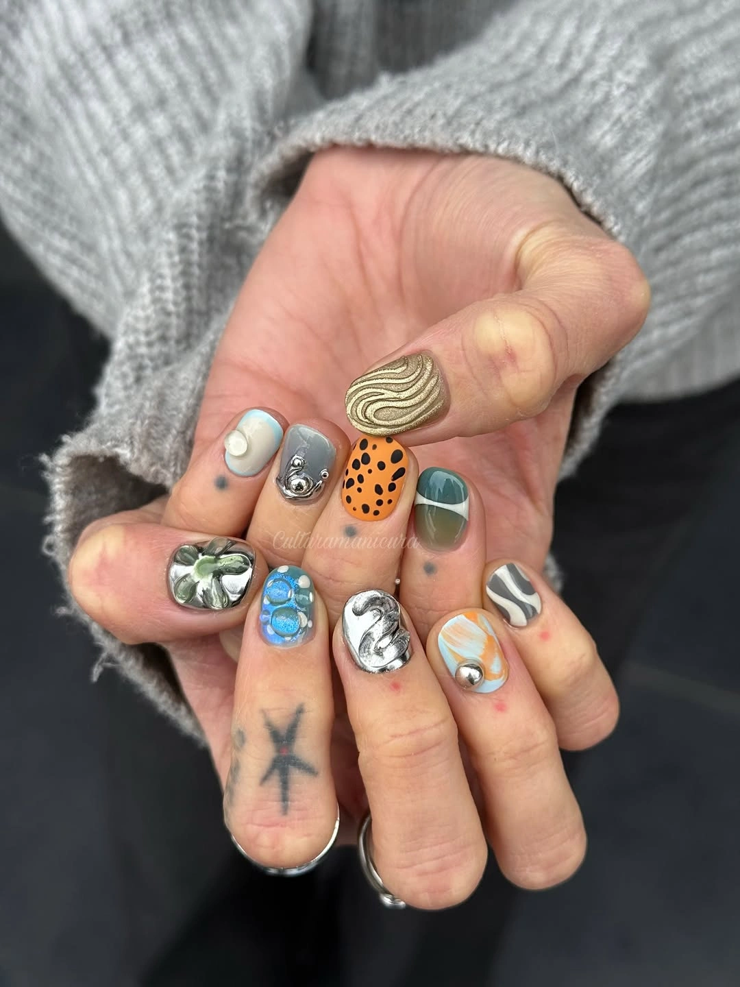 short square nails with varied gray green orange and metallic accents