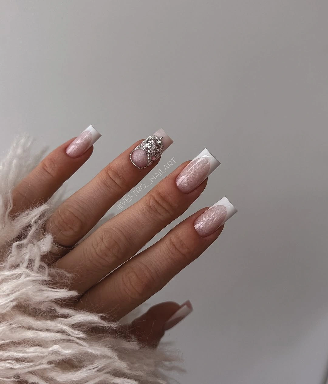 sheer blush square nails with one centered reflective accent
