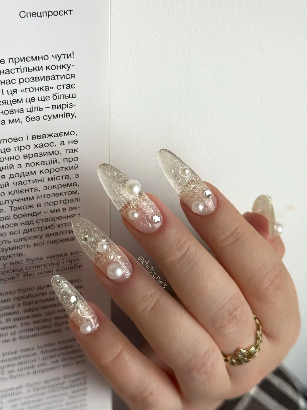 long sheer almond nails with clustered bright round accents