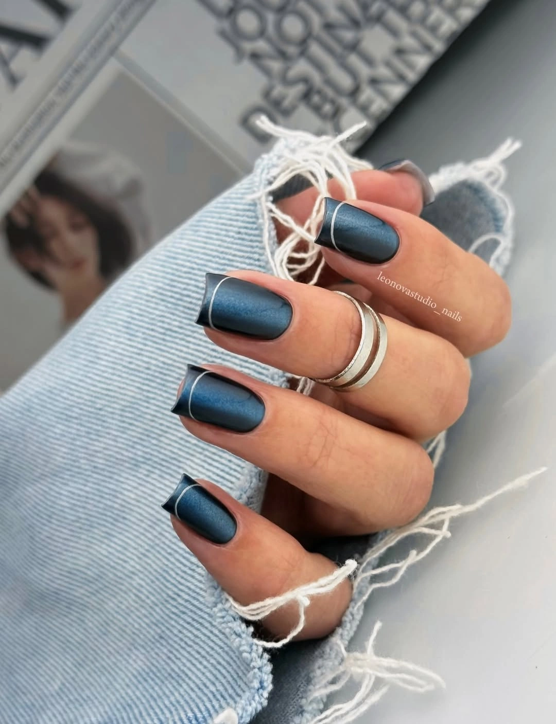 Short matte blue square nails with fine pale edge lines
