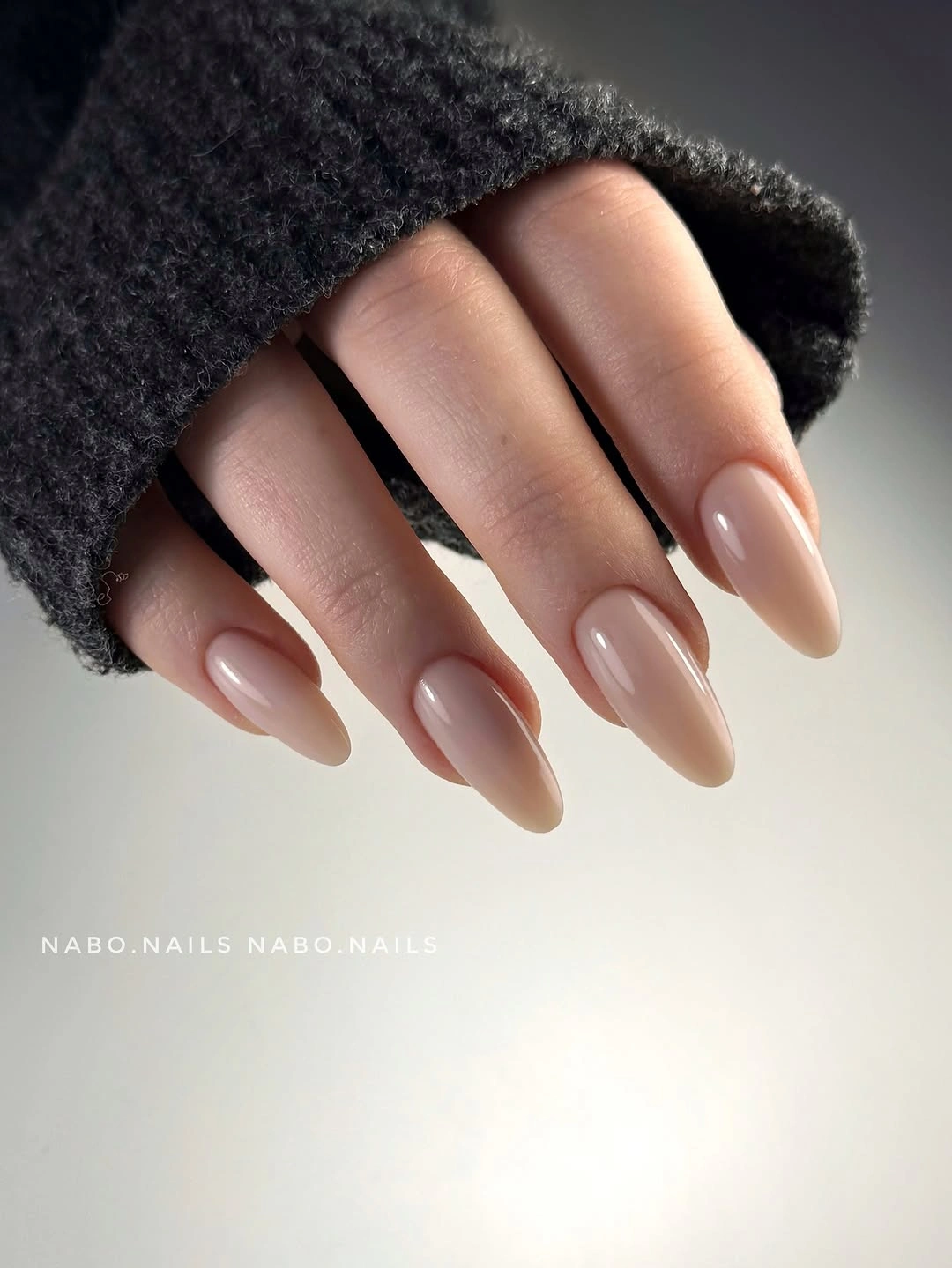 Short almond nails in smooth glossy nude pink