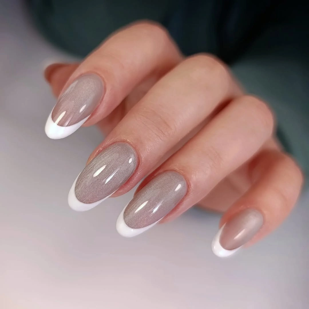 Short almond nails with translucent pink and neat white tips