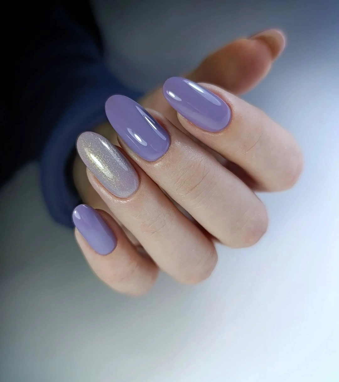 Milky almond nails with scattered pink red marks