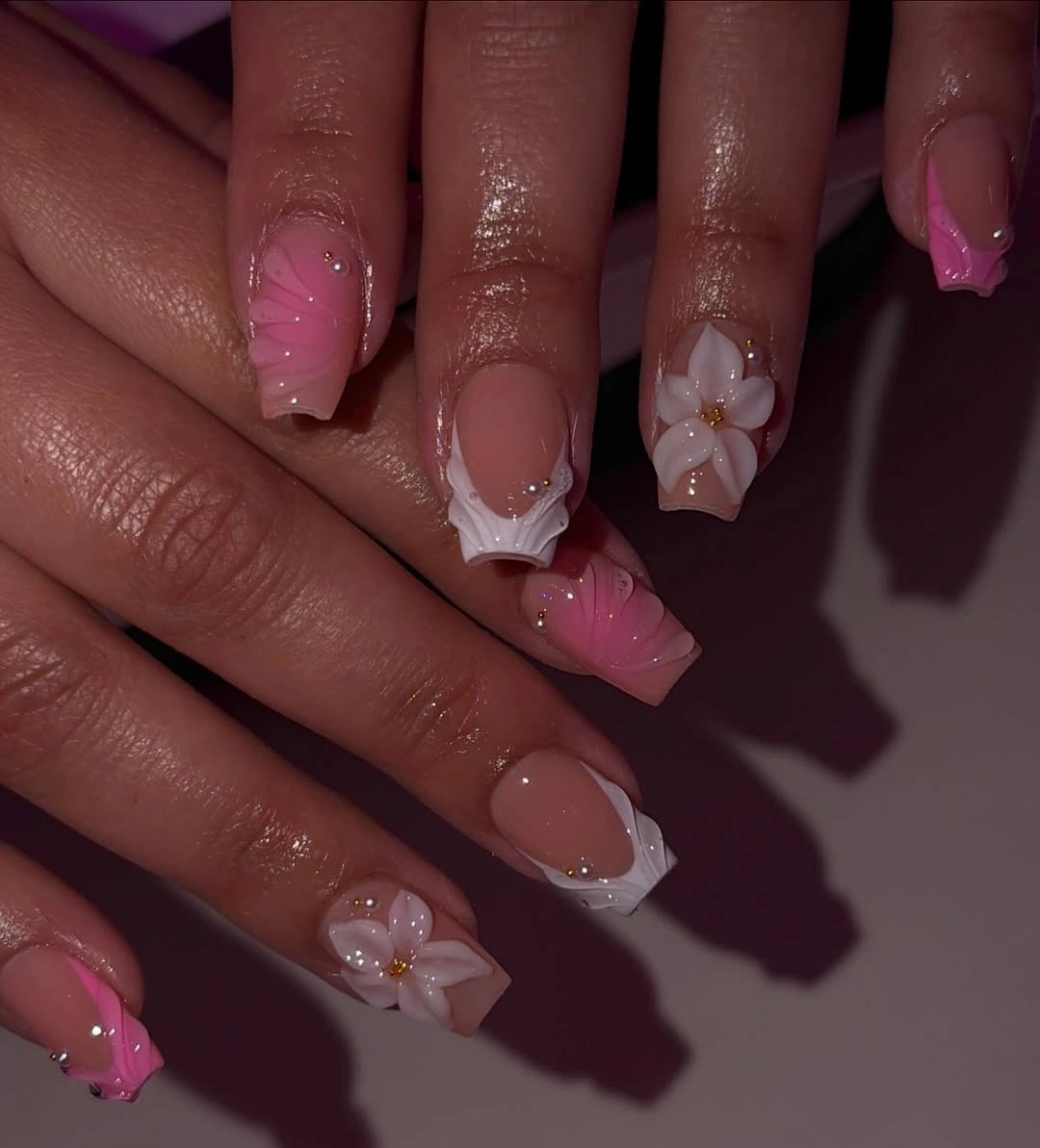 Medium square blush nails with small white flower accents