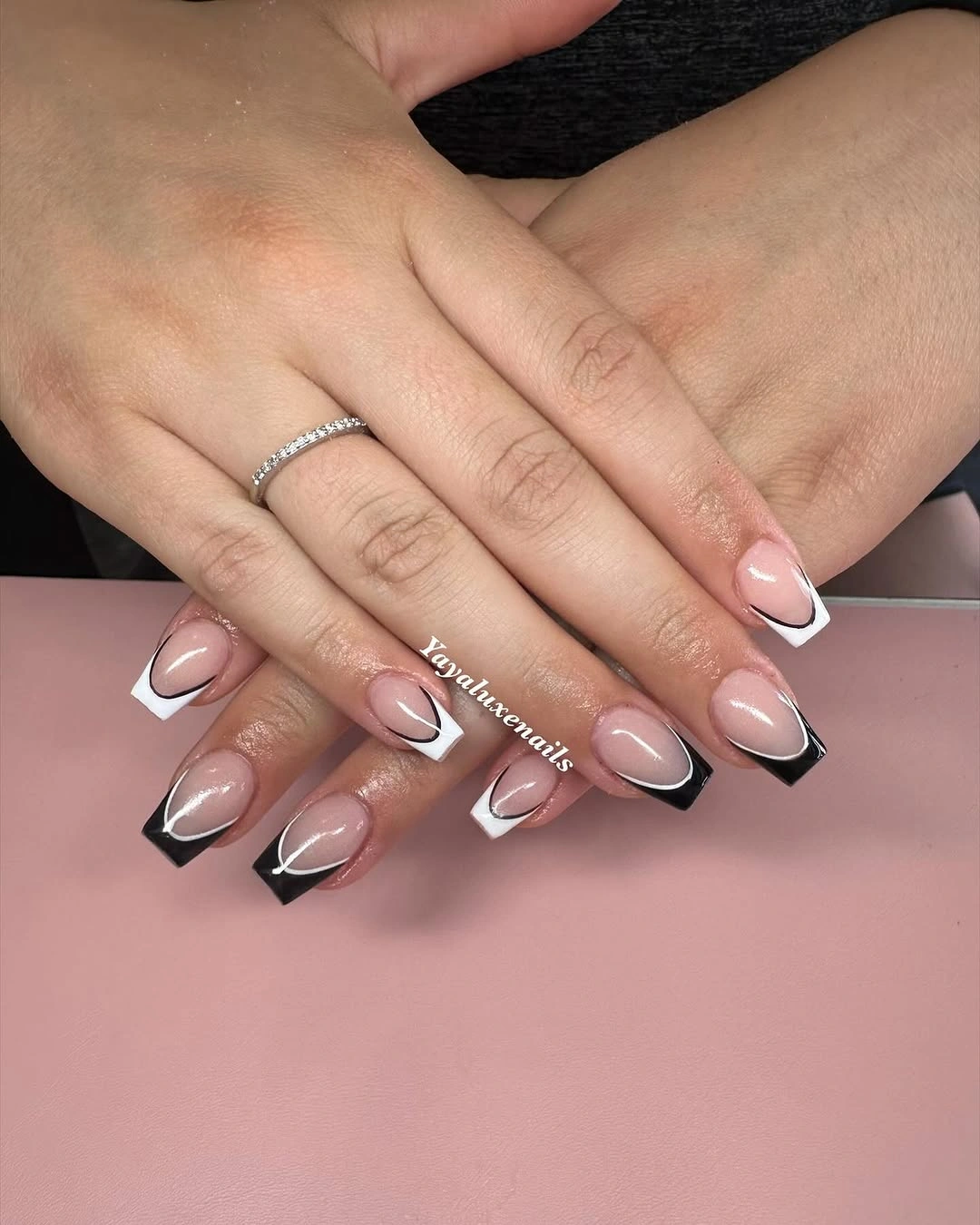 Long almond nails with black and white graphic French tips