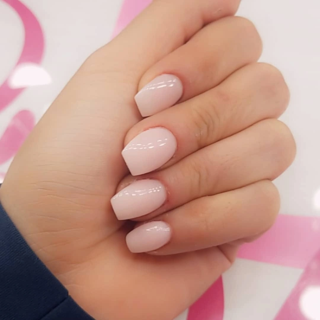 Short oval nails in a smooth pale blush pink finish