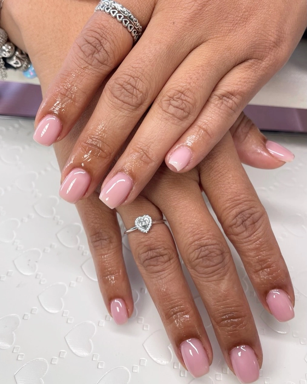 Medium almond nails in a smooth pale pink finish