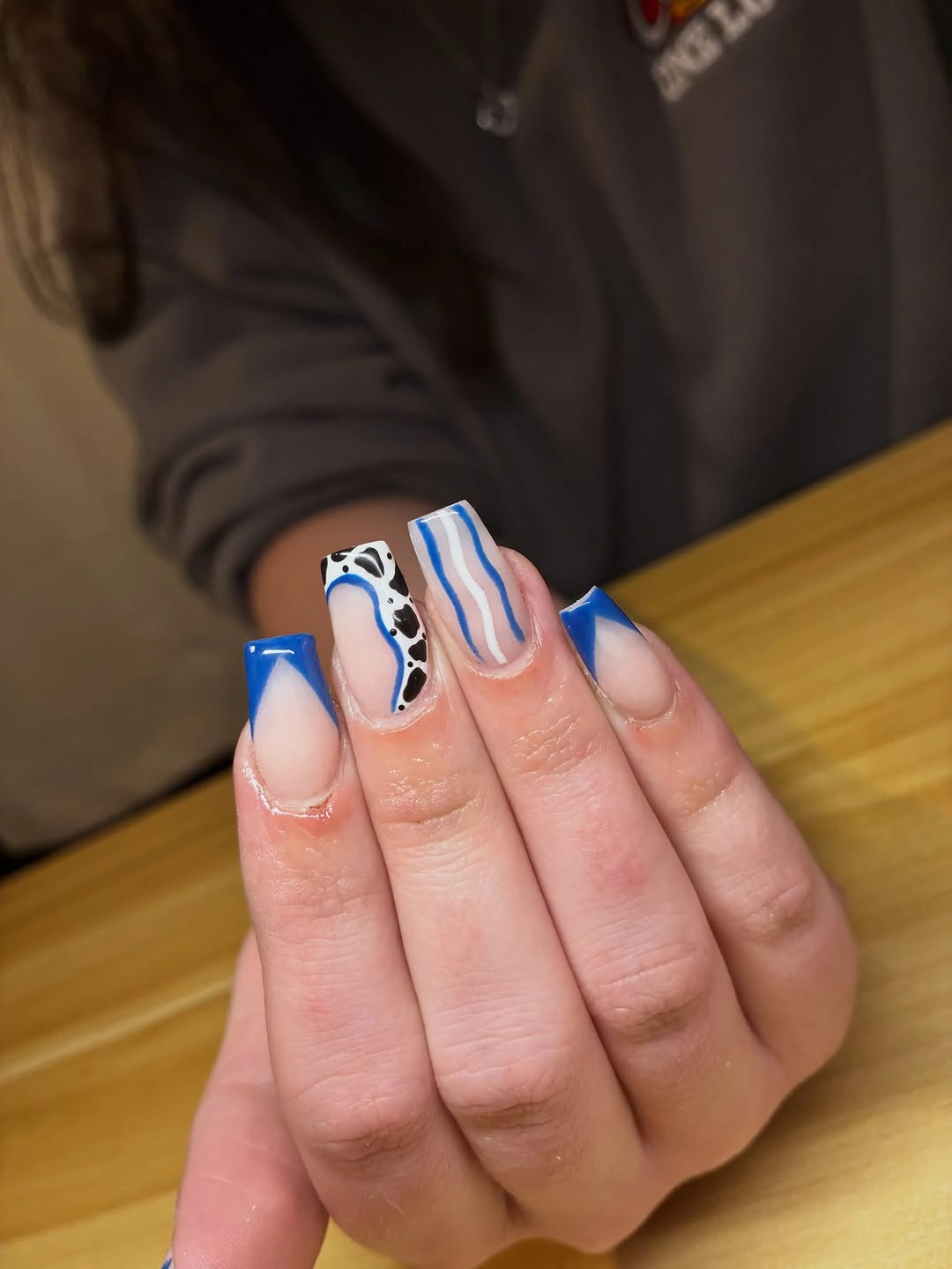 Medium coffin nails with cobalt French tips and black white waves