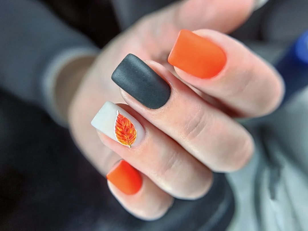 Medium square charcoal orange white nails with accent detail