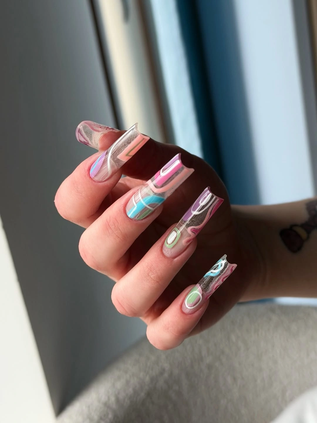 Long square translucent nails with multicolor abstract waves
