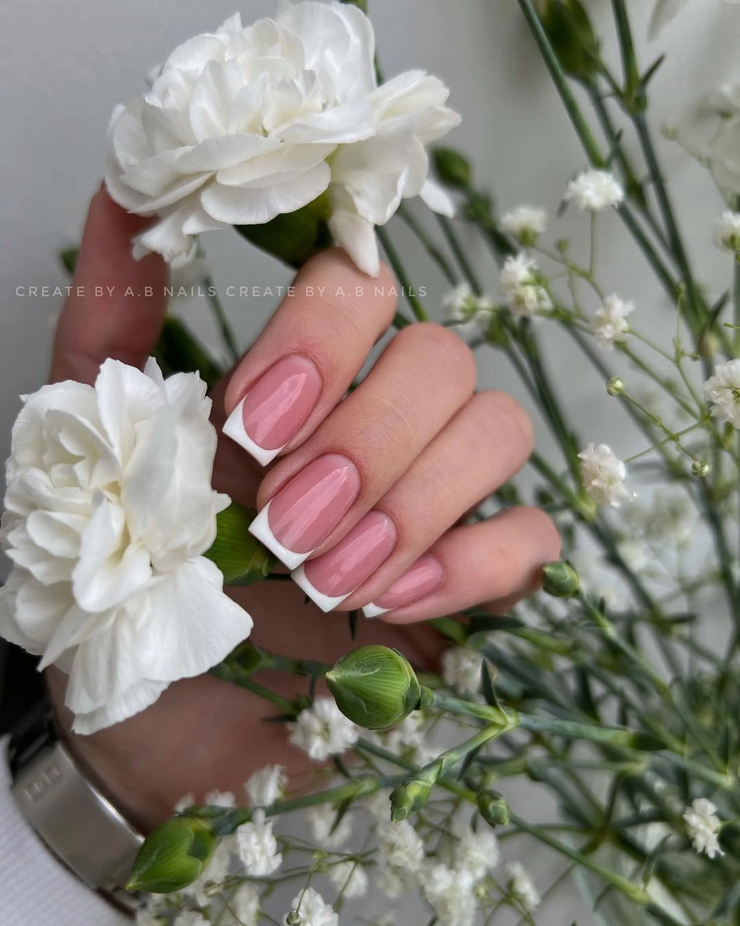 Short fluorescent pink nails with small leopard-like spots