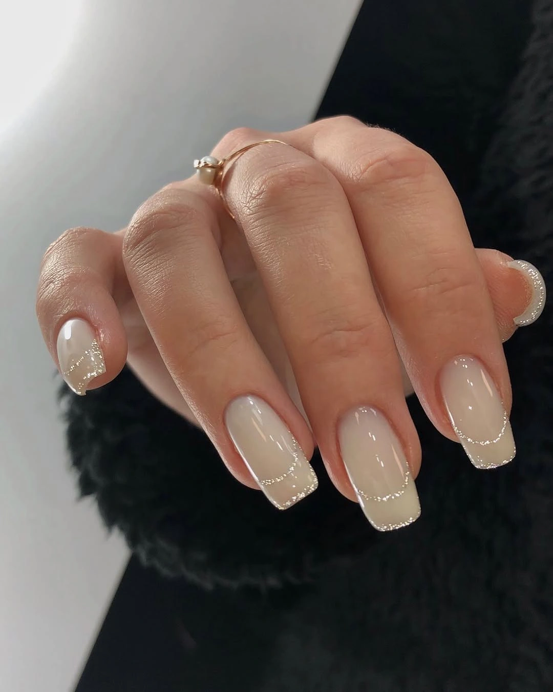 Neutral French nails with dotted silver borders