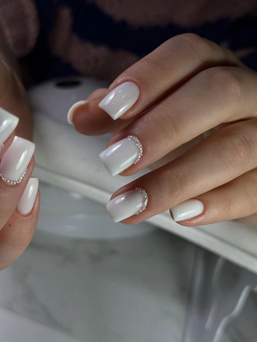 Milky ombre nails with rhinestone cuticle arcs