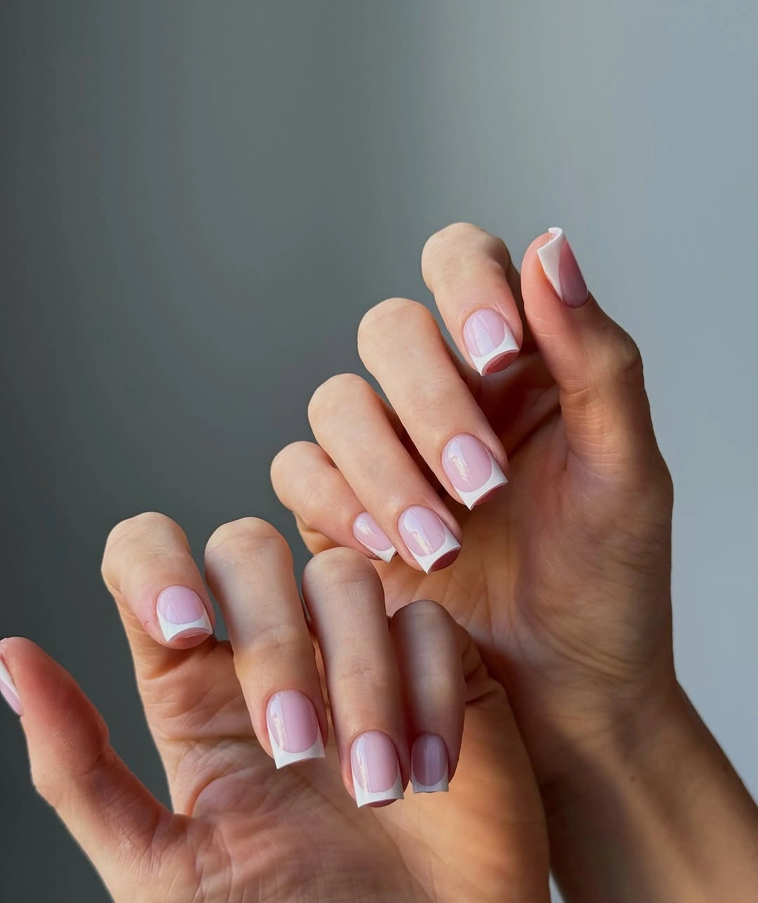 Short square French nails with rounded white arches