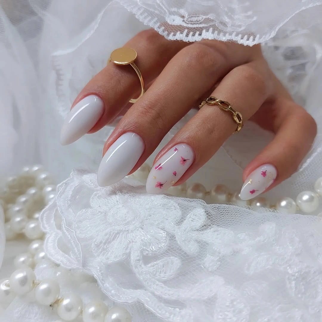 Milky almond nails with tiny pink florals