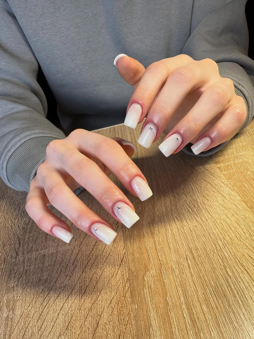 Milky ombre square nails with cuticle stones