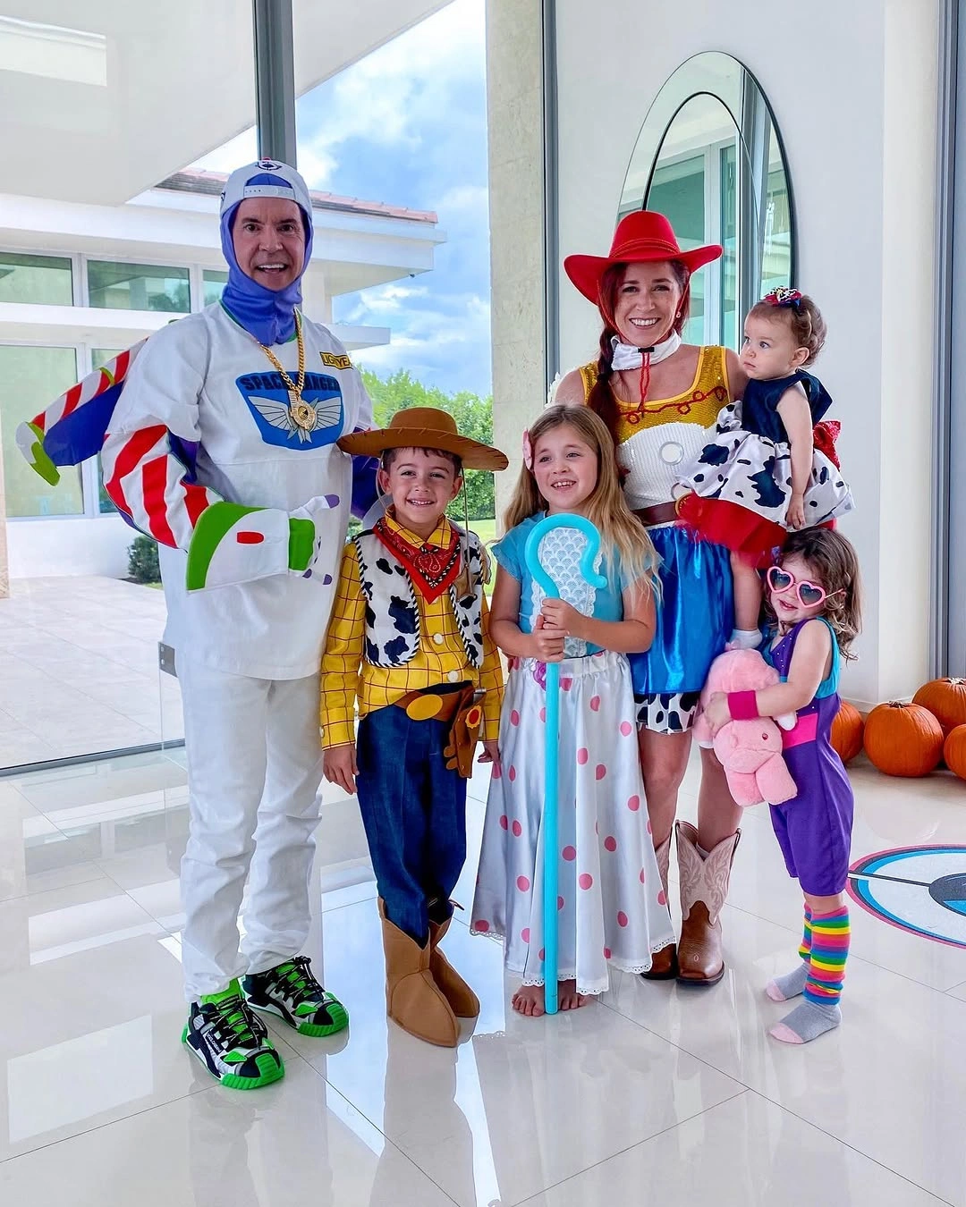 Family costume group with white suits blue dress cowboy and cowgirl outfits