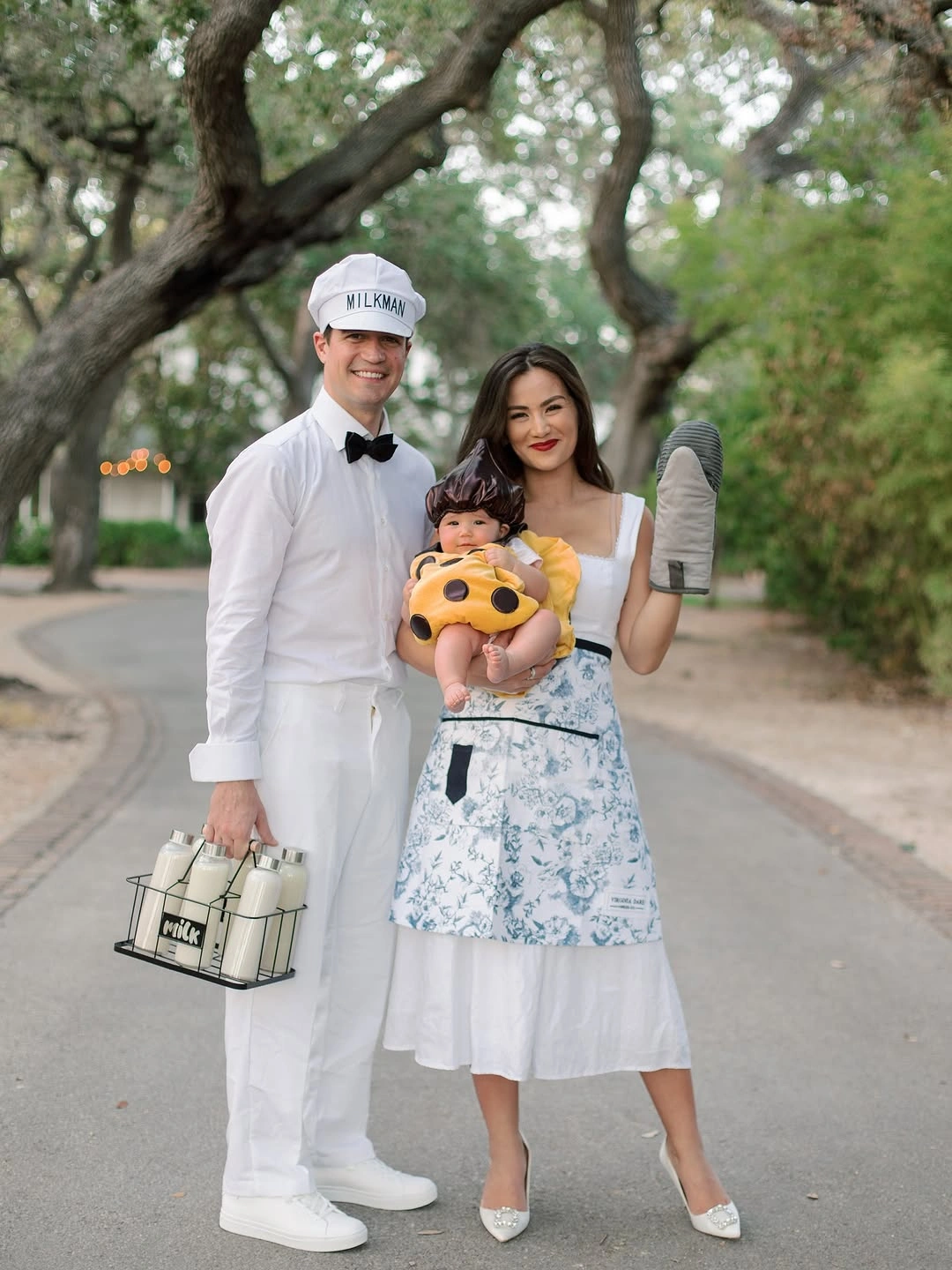 White family costumes with spotted child outfit and oversized prop