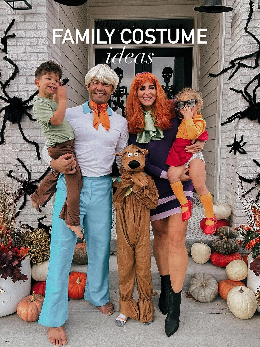 Family in teal orange brown and red retro cartoon inspired costumes