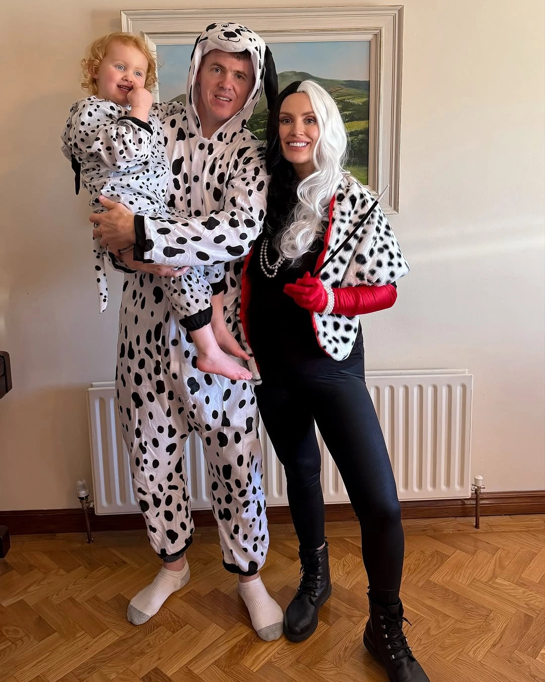 Family Halloween costumes with spotted onesies and black red accent