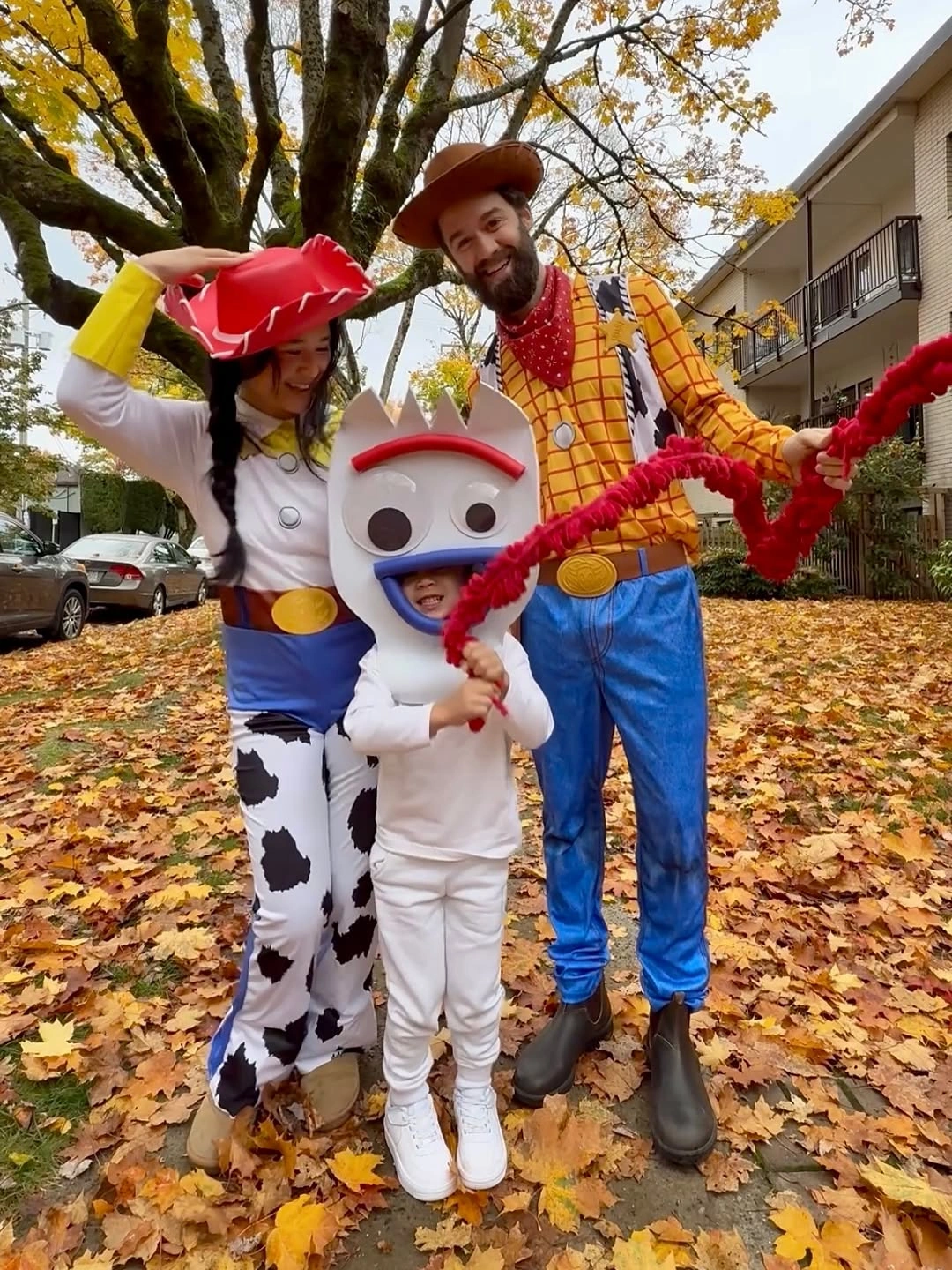 Cowboy family costumes with child in white cow outfit