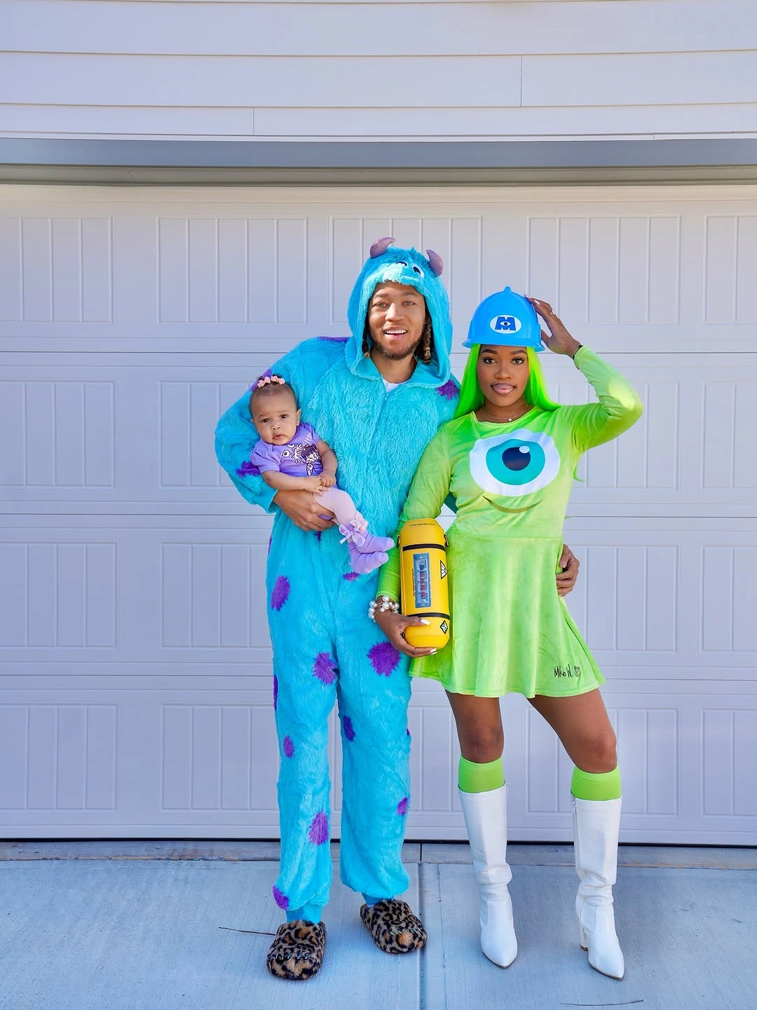 Family with blue furry costume green dress and baby