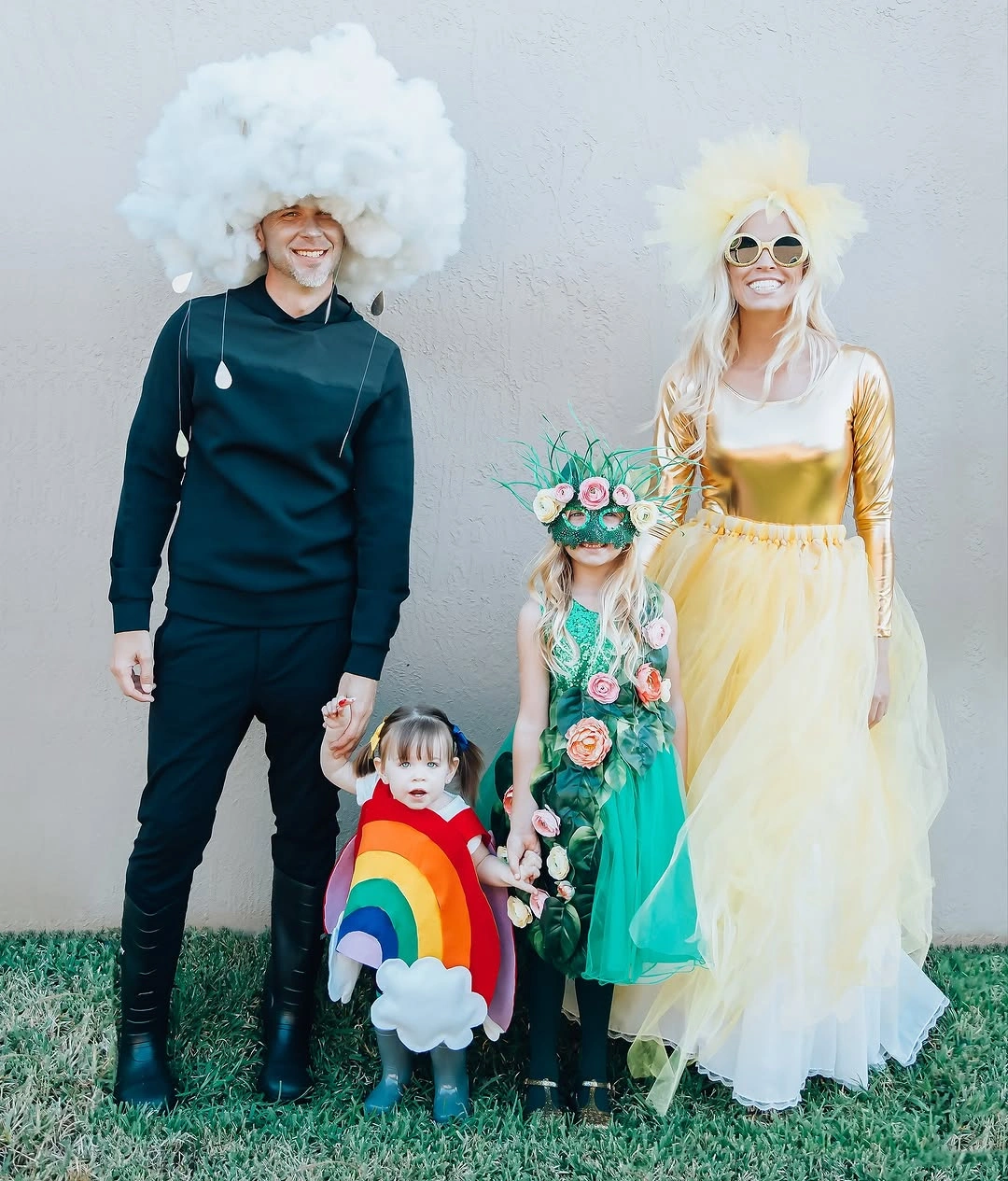 Family Halloween costumes with cloud wig yellow dress rainbow and teal outfit