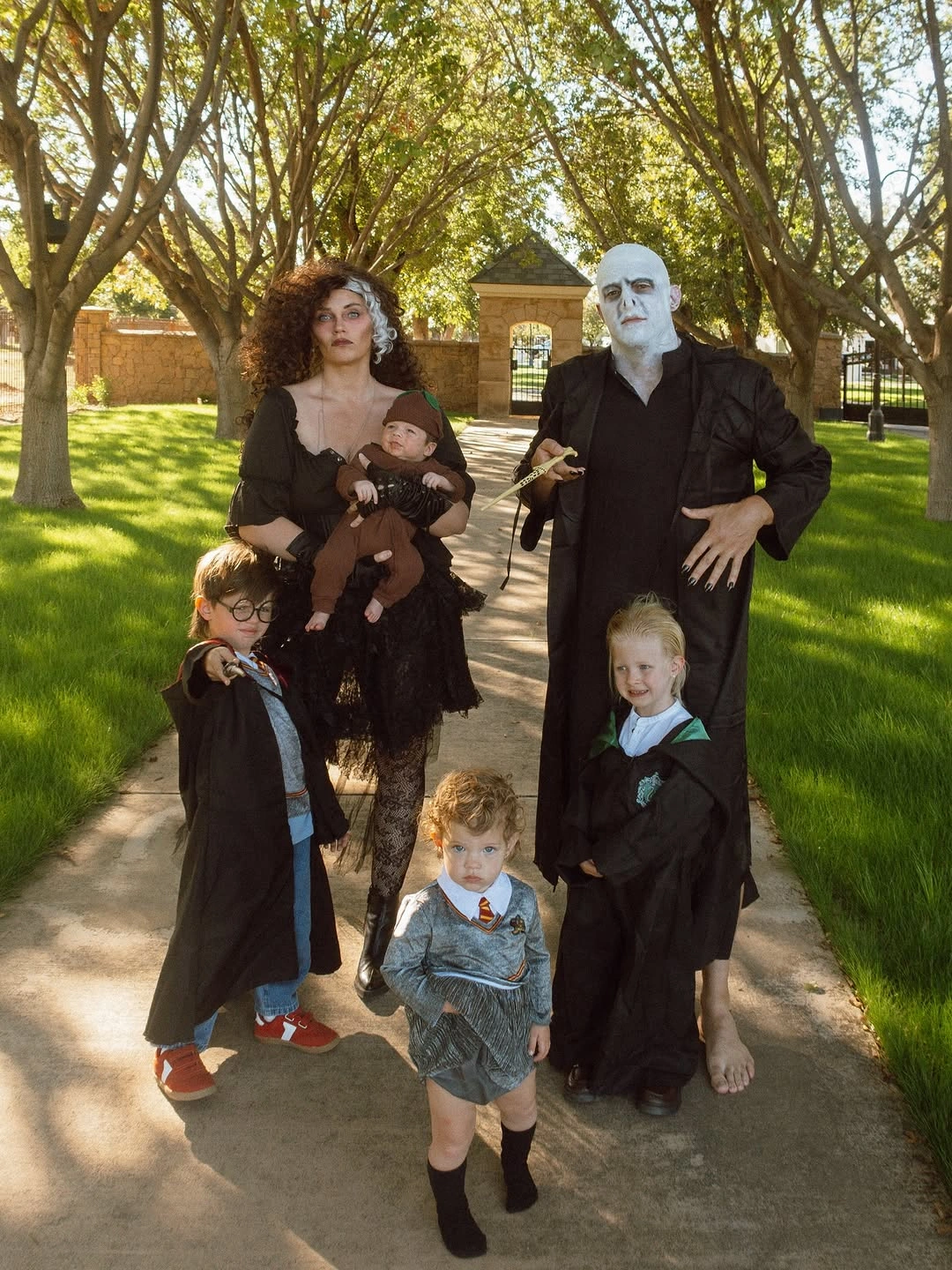 Dark storybook family costumes with stripes and gothic layers