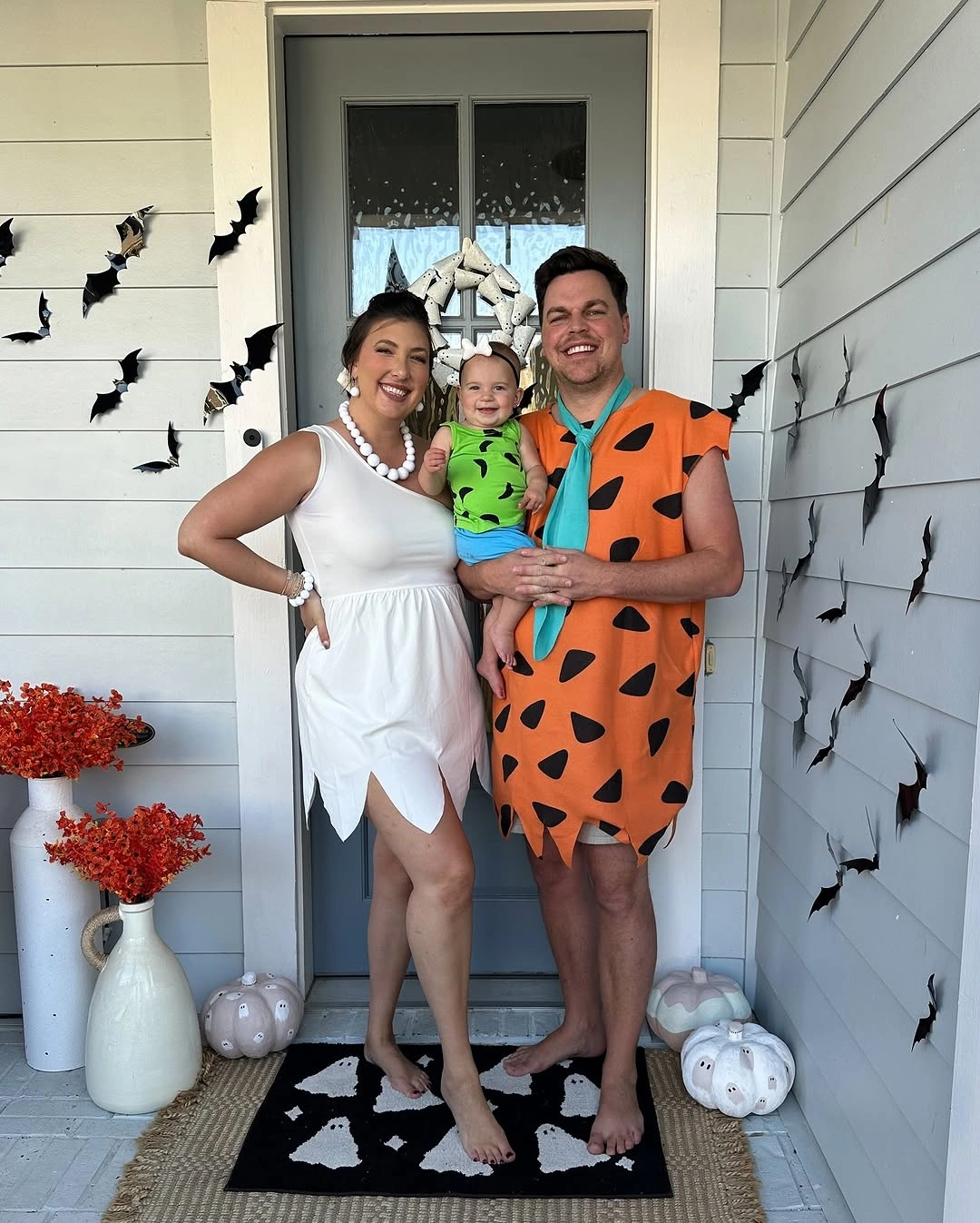 Retro pink blue family costumes with construction jumpsuit and themed cart