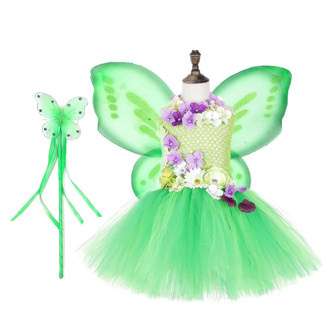 Girl in green fairy dress with translucent wings and floral bodice