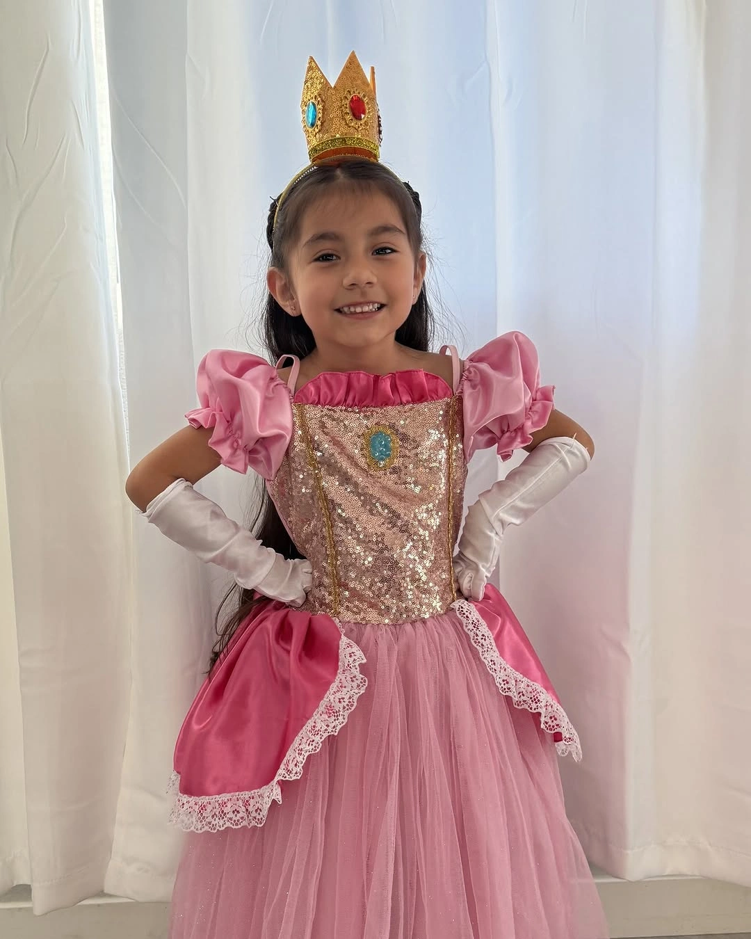 Pink princess costume dress with gold crown and white gloves