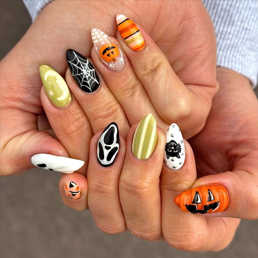 Lime white orange and black Halloween nails with ghosts, webs, and pumpkin faces