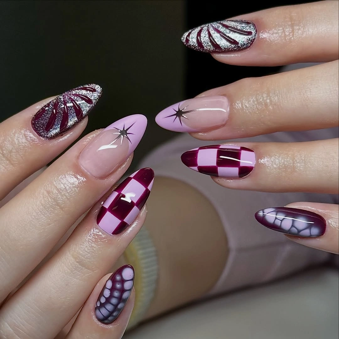 Long pink almond Halloween nails with purple red abstract plaid mesh and leaf-like motifs