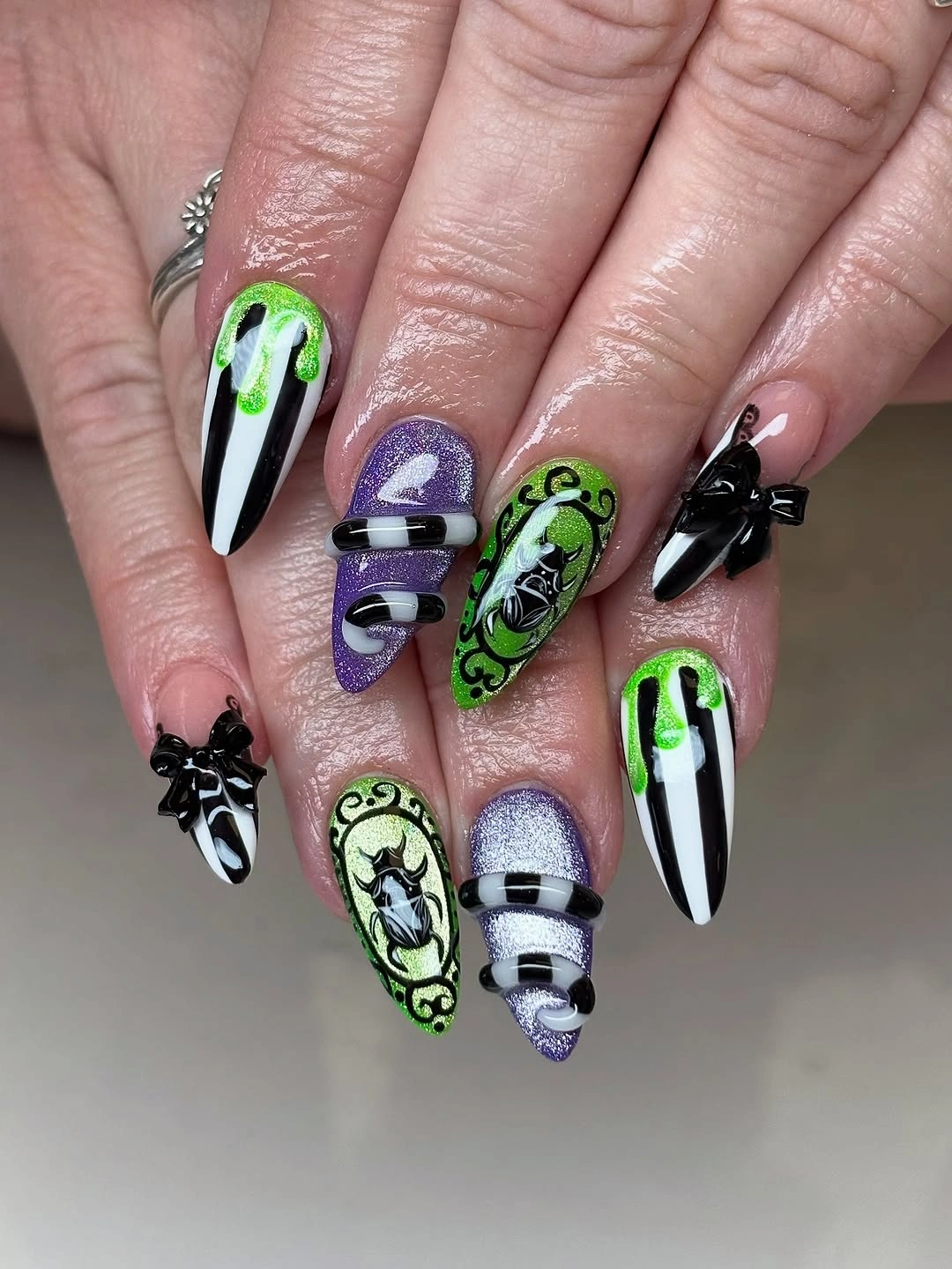 Long lime green black purple and white Halloween stiletto nails with bold spooky graphics