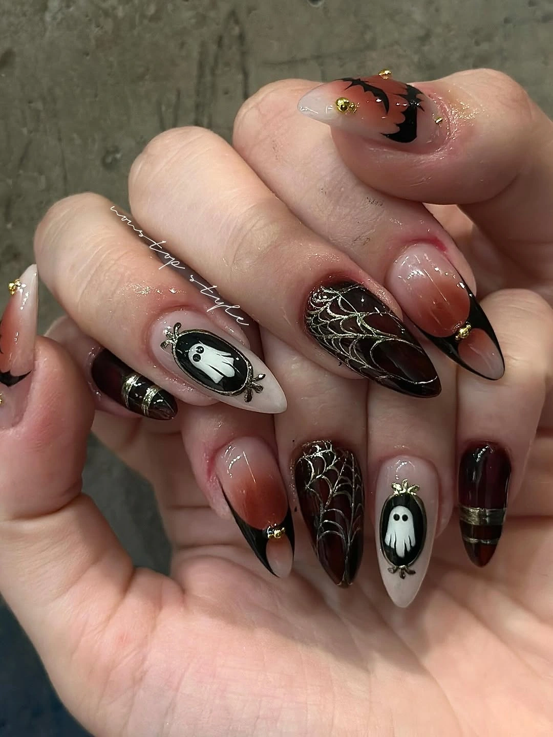 Long black brown and transparent almond Halloween nails with web and ghost details