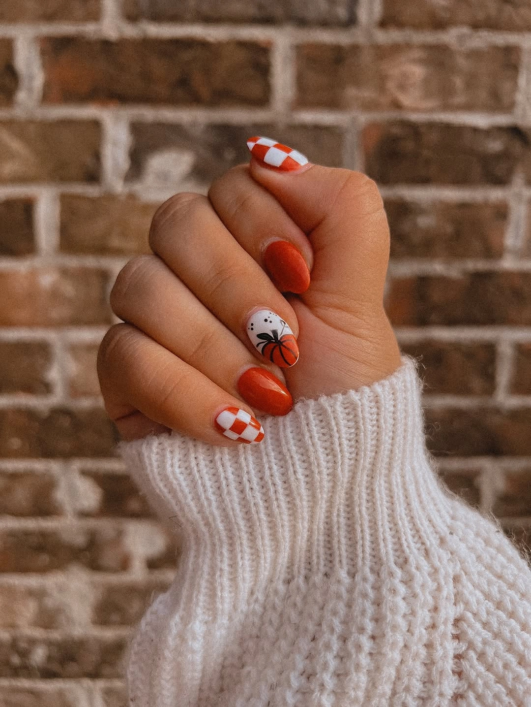 Warm red nails with white candy cane tips and tiny ghost