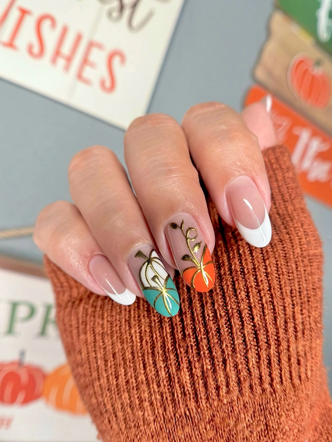 Sheer pink nails with orange French tips butterflies and white accent