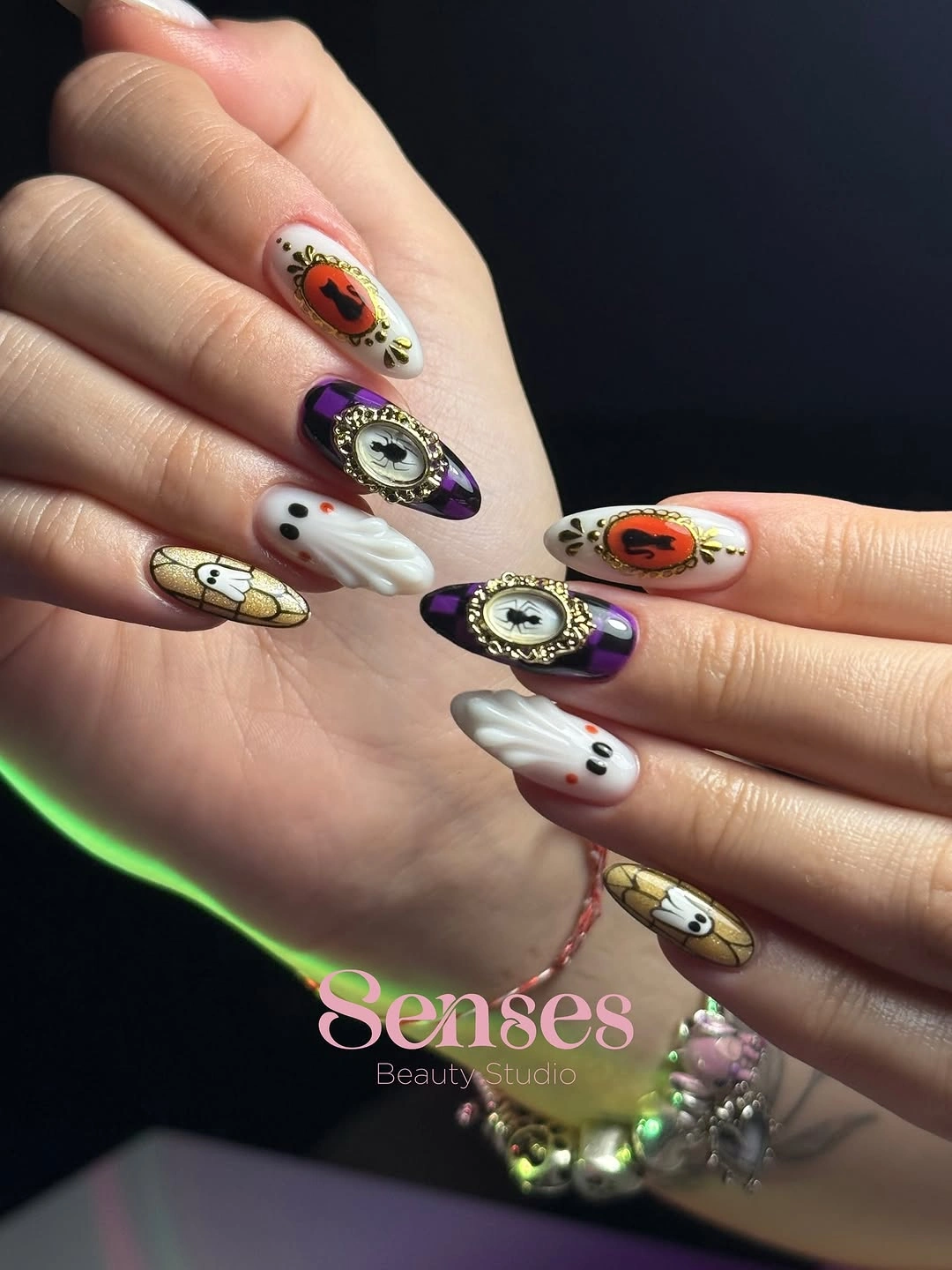 Short to medium purple black and white Halloween nails with ghost cartoon details