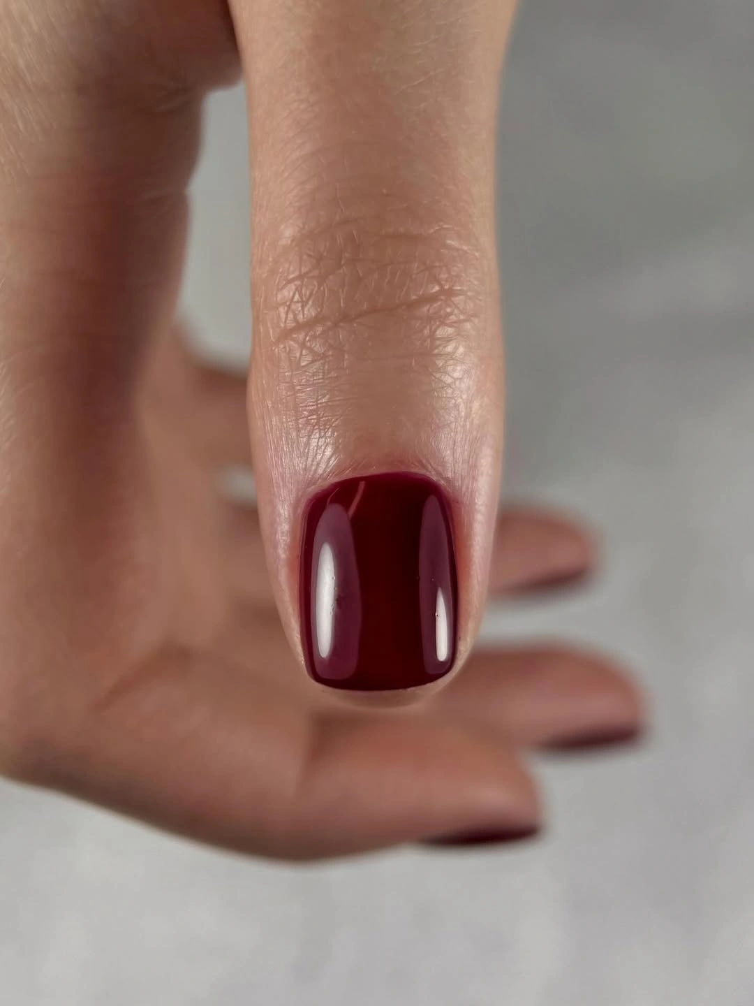 Short soft square nails in smooth rich burgundy