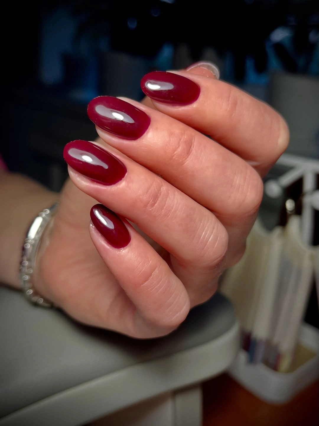 Medium rounded nails in glossy cherry maroon