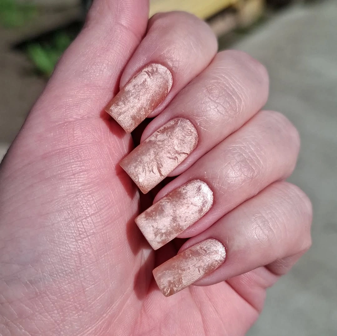 Short rosy taupe square nails with cloudy pearly textured finish