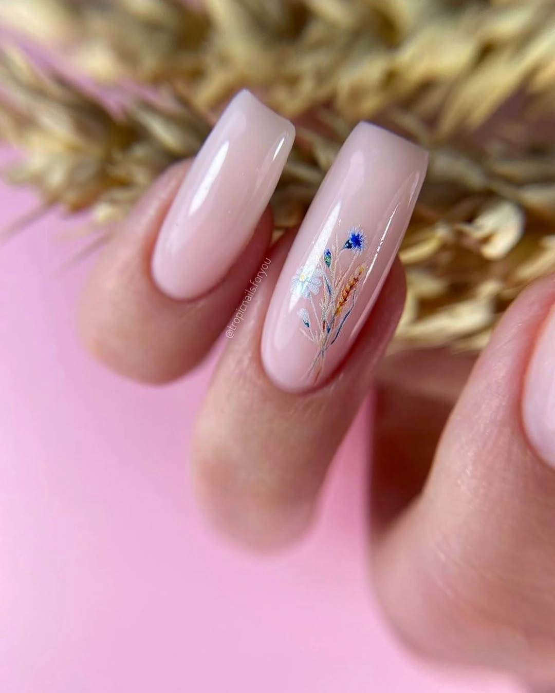 Long pale pink nails with a blue green botanical accent