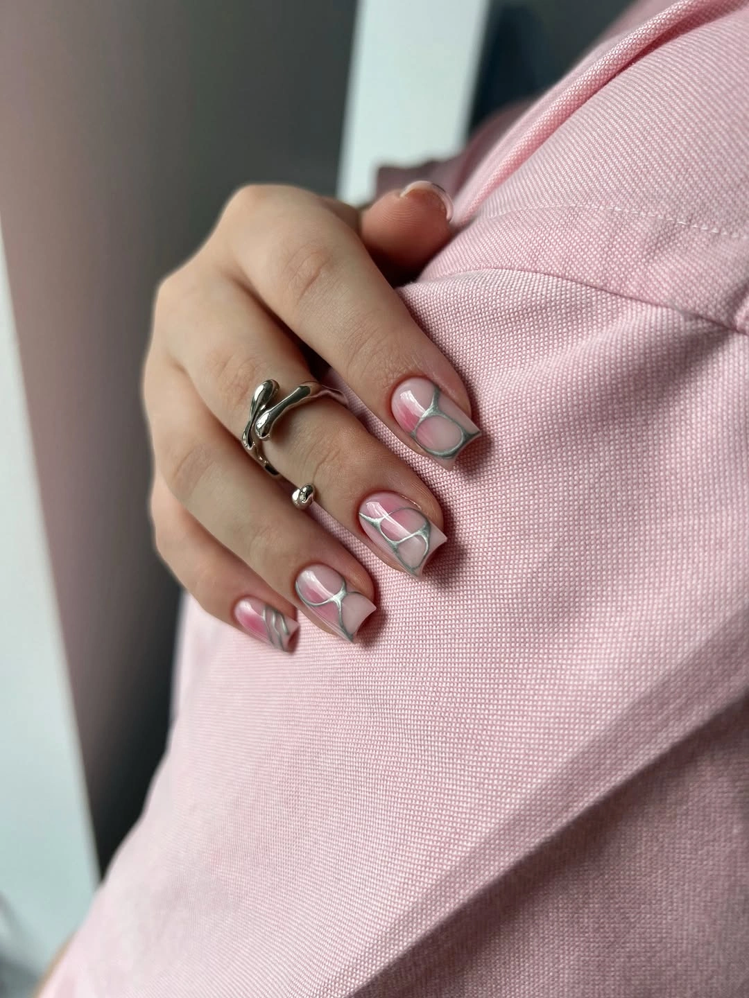 Medium square sheer pink nails with tiny outlined accents