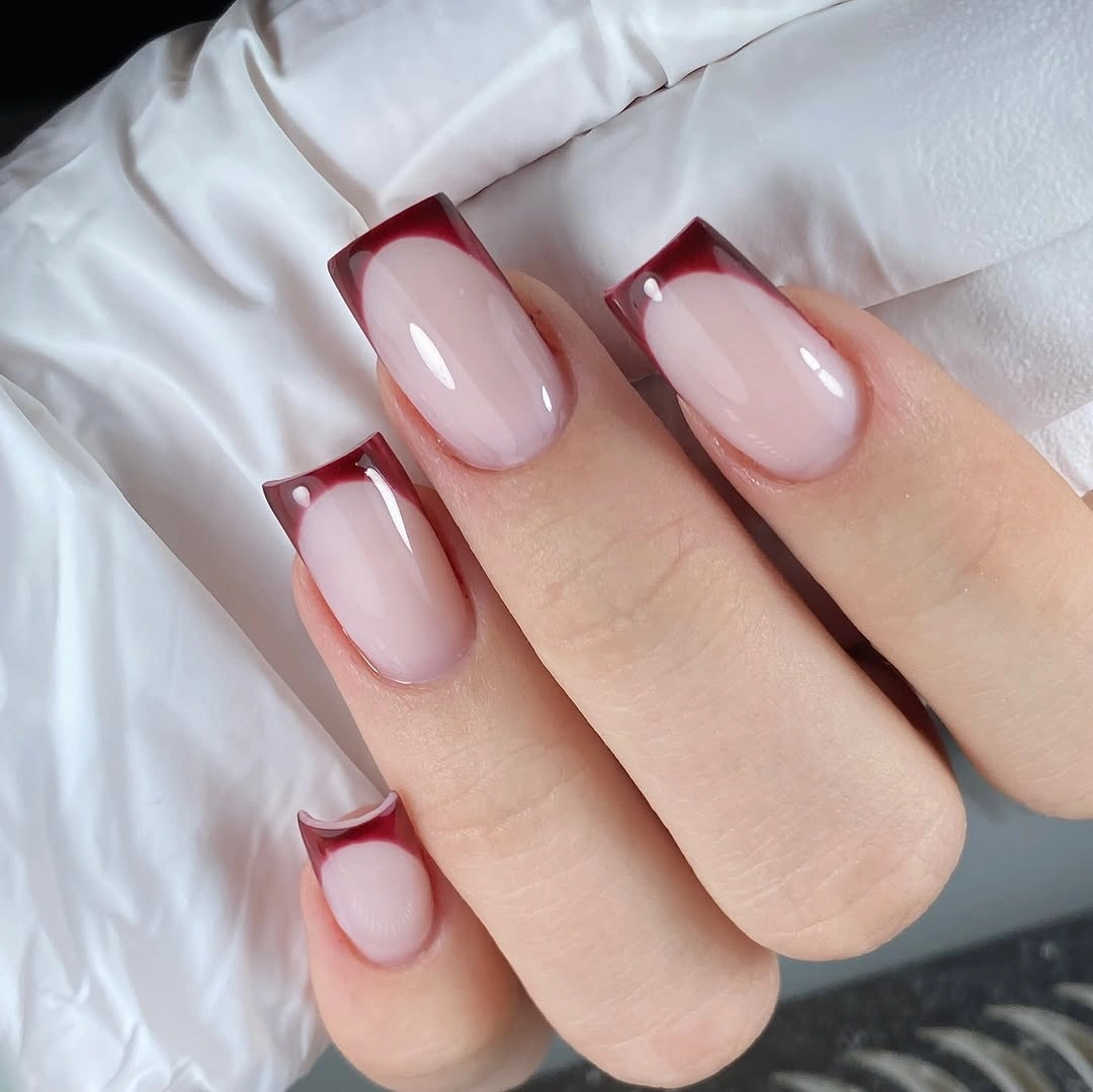 Square sheer pink nails with burgundy French tips