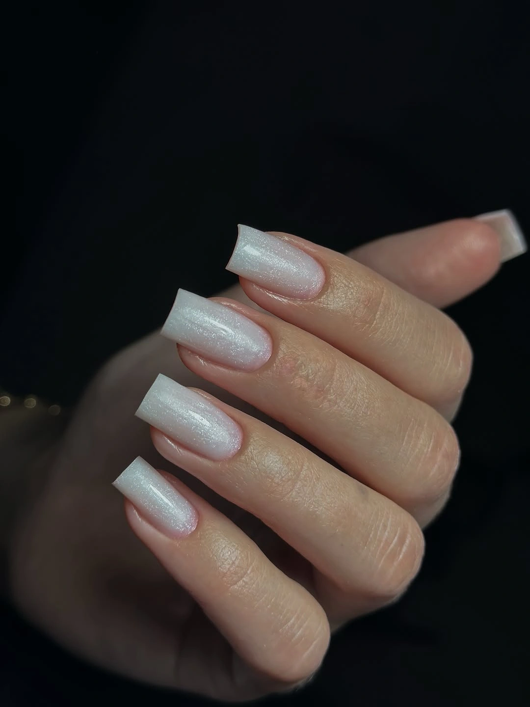 Medium square pale pink nails with subtle icy shimmer