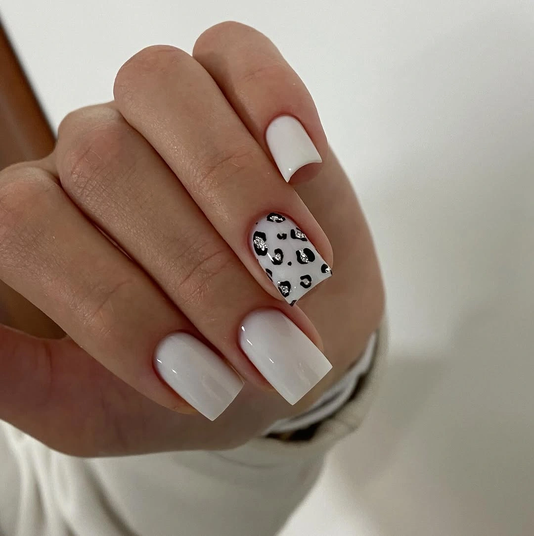 Medium square milky French nails with leopard heart accent