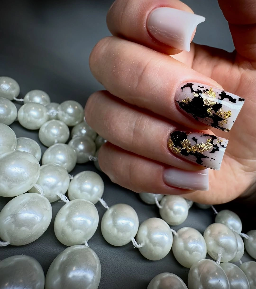 Medium square white French nails with dark gold accent