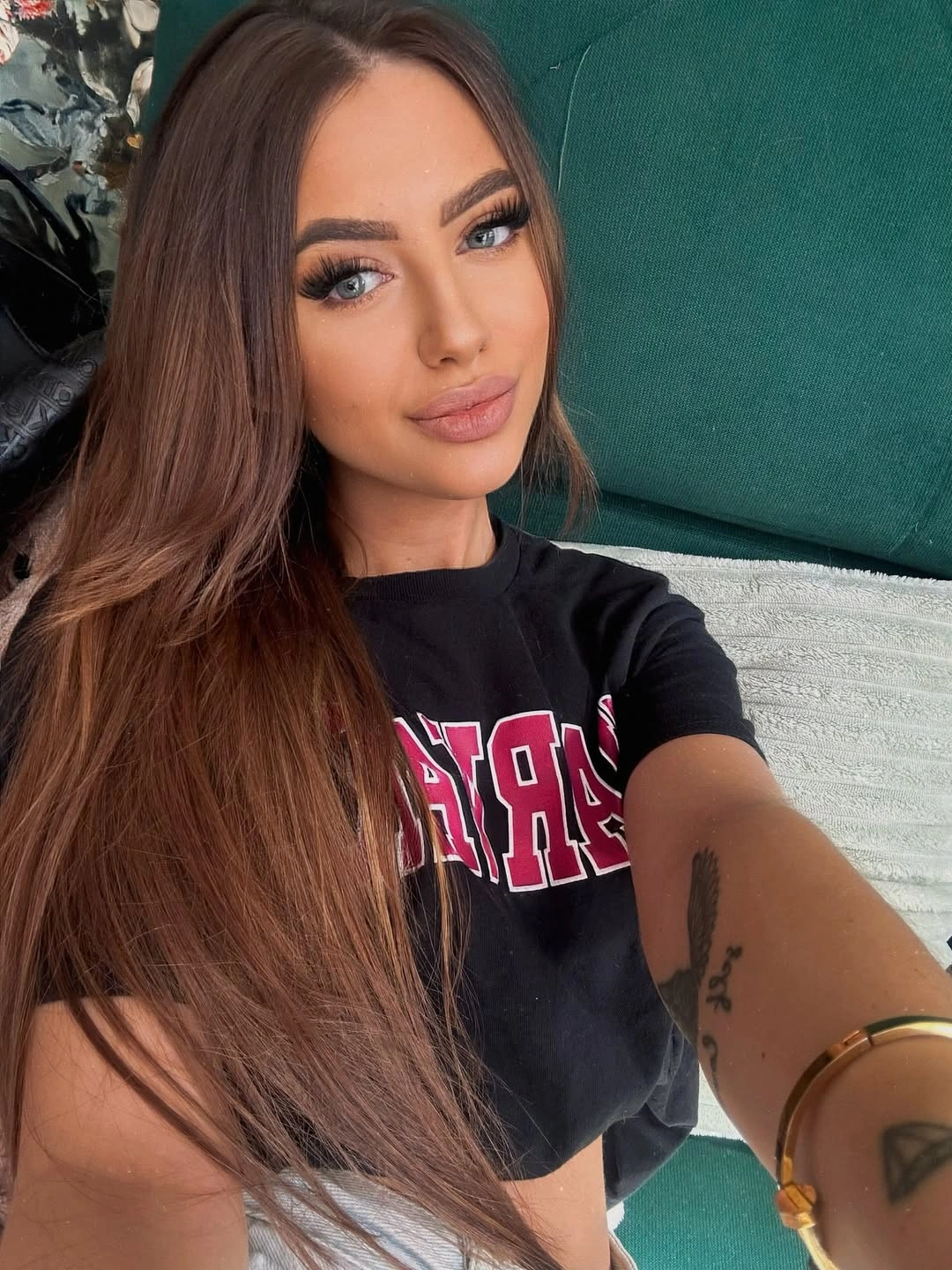 Long warm brown hair with center part and soft loose waves